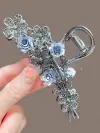 Imported black alloy hair clips with beautiful blue flowers.