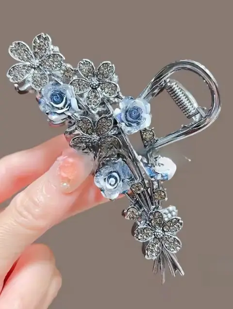 Imported black alloy hair clips with beautiful blue flowers.